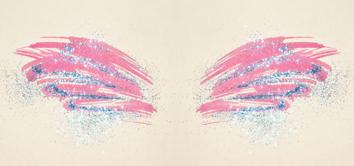 Blue glitter on abstract pink watercolor wings in vintage nostalgic colors, beautiful feathers