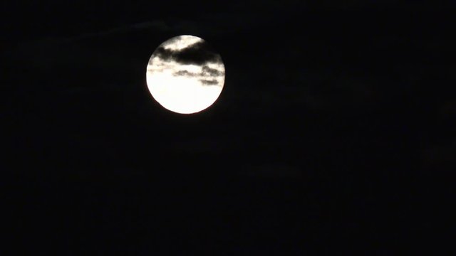 Full Moon Rises in Clouds on Sky in Night, View Moon Light, Evening Background