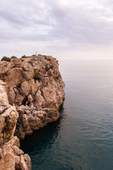 Sunset on a cliff with the sea below. Beach of Salobreña in Granada, Andalusia, Spain.