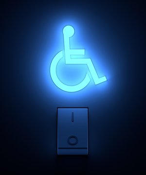 Light switch turning on accessibility sign with soft blue colour. Image concept and part of a series.