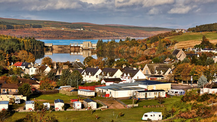 View over the village of Lairg in the Highlands of Scotland to Lairg dam and Loch Shin