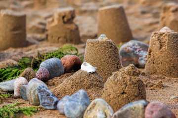 Sand castle on a beach ringed by shingle