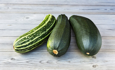 Zucchini. Fresh zucchini or courgette on wooden.