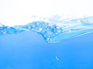 Fototapeta na wymiar Clean blue water and waves against a white background