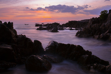 sunset on coast of sea