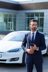 Businessman wearing stylish suit walking to office