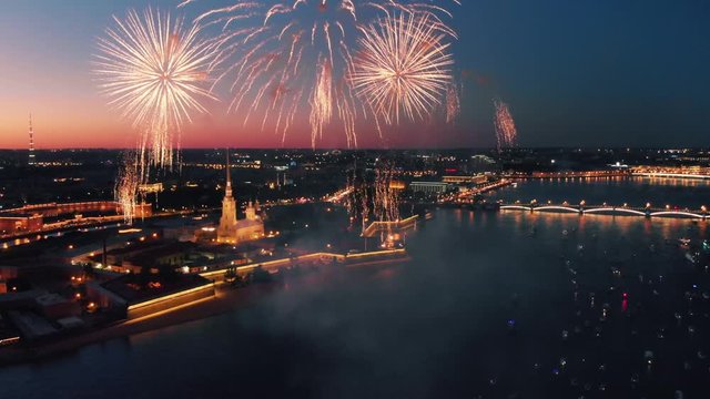 Fireworks display over river and night city skyline. Saint Petersburg, Russia. 4K UHD.
