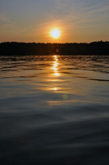 Sunset orange lake water reflection landscape. Sunset water reflection.