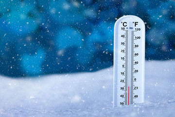 thermometer on snow ground in snowy day