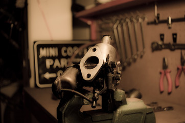 old carburetor on a workbench