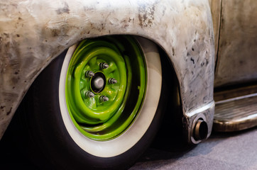 green wheel of an old american car