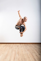 Beautiful male ballett dancer performing indoor