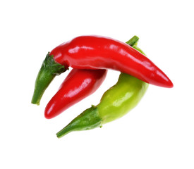 pile of various kind of chilli peppers isolated on white background