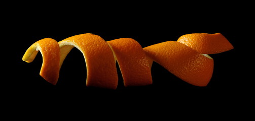 Orange peel isolated on black background