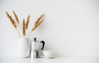 White home decor, coffee maker, ceramic vase and cup on tabletop, contemporary interior