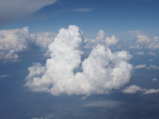 blue sky with clouds background seen from flying plane