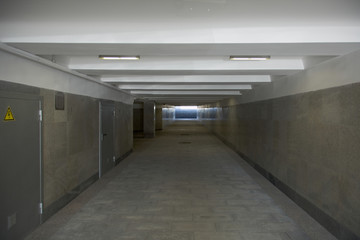 The underground passage lined with gray granite and marble