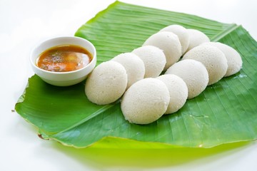 Idlis /Steamed rice cakes - South Indian breakfast served in banana leaf, selective focus