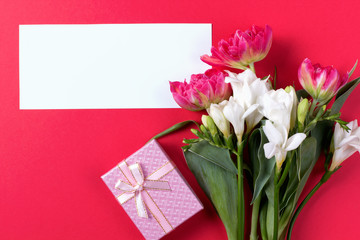 Spring flower mockup with gifts. Floral composition with copy space. Flat lay style