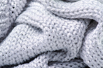Gray silver warm knited material fabric sweater texture blur background