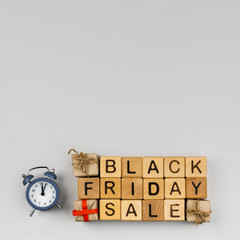 Top view of black friday cubes on plain background