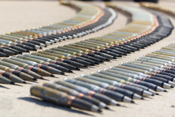 A row of ammunition cartridges - row of bullets in the circle