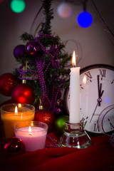 Christmas decorations White little Christmas tree with a clock on a dark background. Background for design. Happy New Year 2020. .