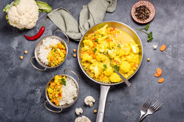 Vegetarian curry with cauliflower and chickpeas, healthy homemade vegan food, indian cuisine, clean eating concept