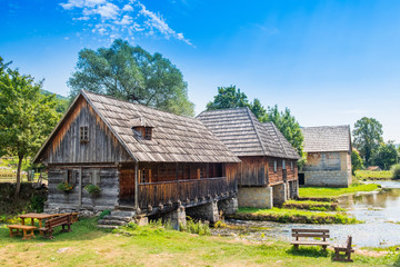 Fototapeta na wymiar Croatia, countryside region of Lika, Majerovo vrilo river source of Gacka, traditional village with old wooden mills and cottages