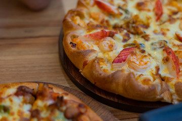 Thai tropical seafood pizza on wooden background