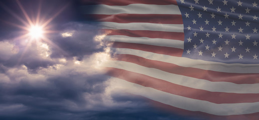 American National Holiday. Cloudy background with American flag and national colors. Copy space.