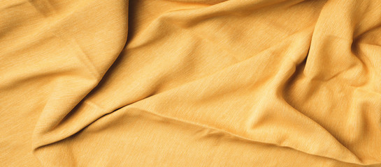 Yellow fabric texture background. Top View of cloth textile surface. Abstract backdrop for design