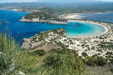Obraz premium Panoramic aerial view of voidokilia beach, one of the best beaches in mediterranean Europe, beautiful lagoon of Voidokilia from a high point of view, Messinia, Greece