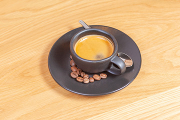 Modern espresso cups on a wooden table