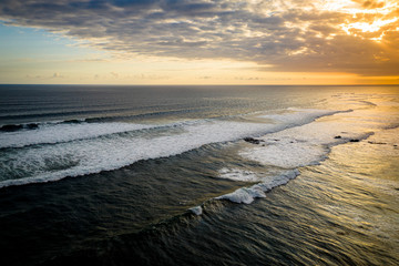 Dramatic sunset over a tropical ocean aerial, Bali, Indonesia