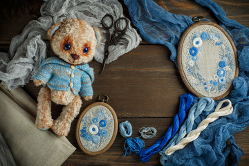Sewing accessories on wooden background © Irina Burakova