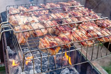 Meat pork beef on the grill cooking process barbecue. traditional outdoor recreation.