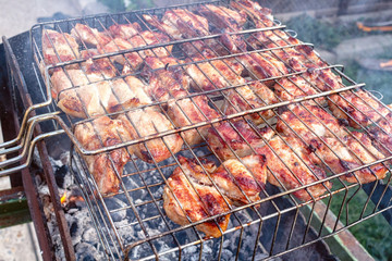 Meat pork beef on the grill cooking process barbecue. traditional outdoor recreation.