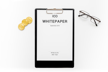 White paper ICO, coins, glasses on white background top view