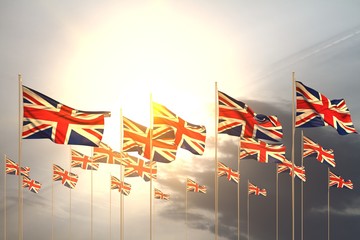 Obraz premium beautiful any occasion flag 3d illustration. - many United Kingdom (UK) flags in a row on sunset with empty space for content