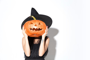 Young brunette woman in black hat and costume on white background. Attractive caucasian female...