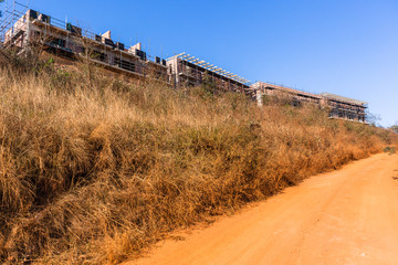 New building Construction Apartments Developments Halfway Dirt Road Hillside Landscape