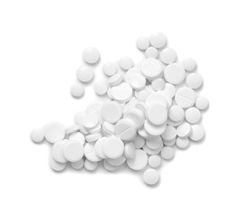 Heap of pills on white