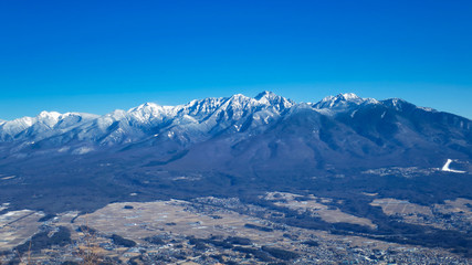 Fototapeta premium 八ヶ岳 雪山 冬 青空 山並