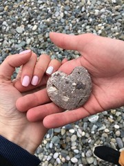 hands holding stones