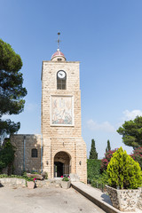Clock tower and bell tower over the entrance to the Greek Orthodox Monastery of the Transfiguration...