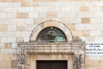 The bas-relief depicting the Mother of God and the Baby above the entrance to monastery on territory of the catholic Christian Transfiguration Church located on Mount Tavor near Nazareth in Israel