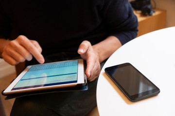 young man using a digital tablet