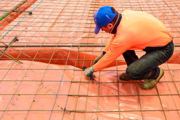 Australian builder performing steel fixing works