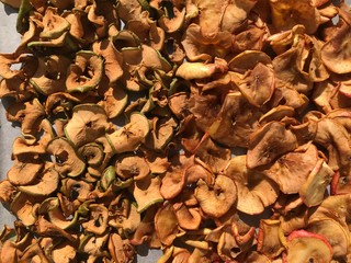 dried organic green and red apples under the sun